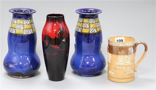 A pair of Doulton vases, a flambe vase and a silver mounted stoneware mug tallest 21.5cm